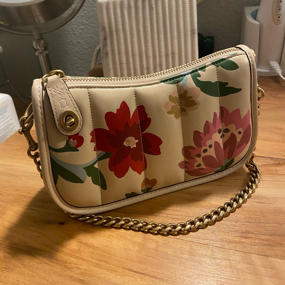 Coach Swinger 20 with quilting and floral bouquet